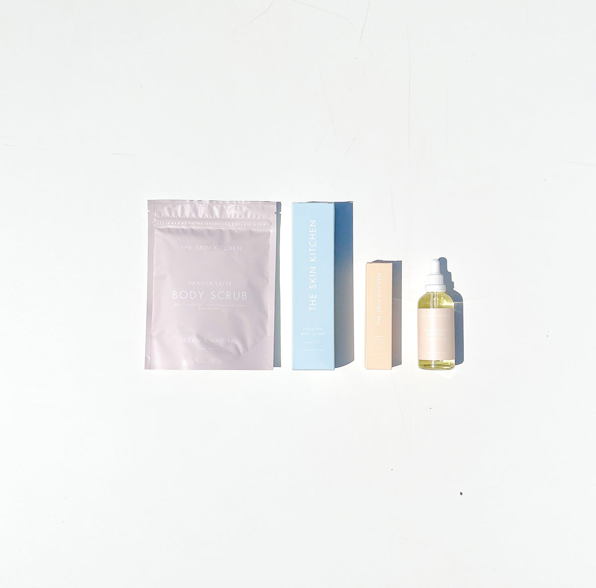 Skincare Bundle. Coconut + Vanilla Body Oil in Limited Edition dropper bottle, Vanilla Latte Body Scrub, Vanilla Coconut Lip Scrub, Hydrating Body Lotion fragrance free,