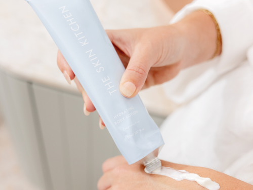 Applying The Skin Kitchen fragrance-free Hydrating Body Lotion to the skin.